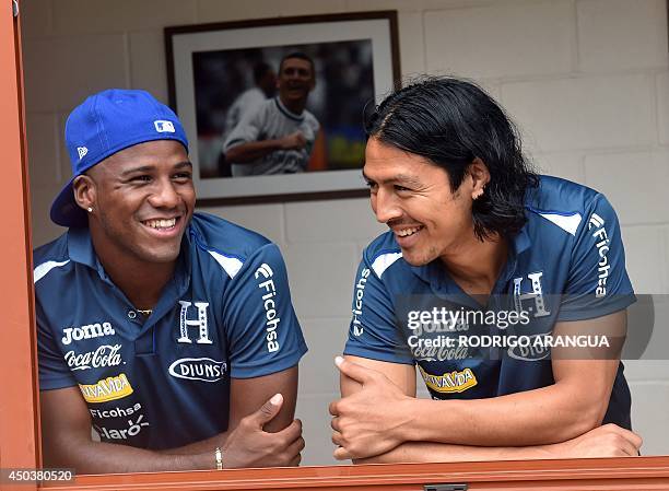 Honduras' defender Juan Carlos Garcia and midfielder Roger Espinoza smile as they wait for their FIFA credential in Porto Feliz, Brazil on 10 June...