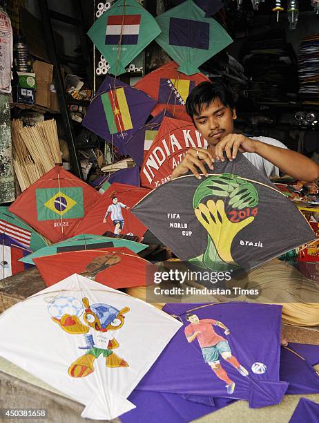 Kite maker arrange some special kites depicting the national flags of the teams participating in the FIFA World Cup 2014, at a kite shop on June 9,...
