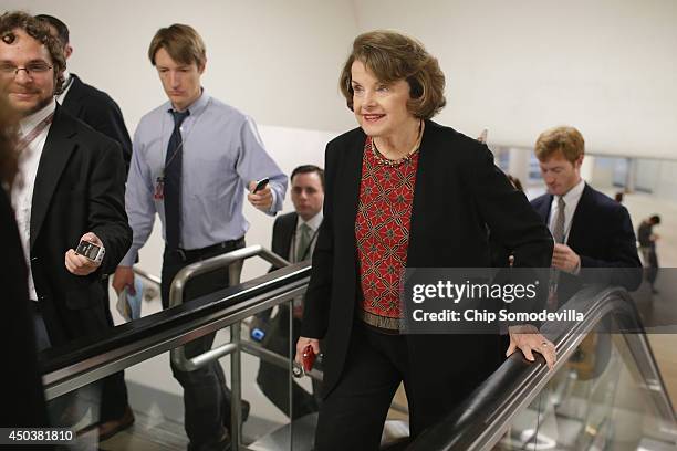 Senate Select Committee on Intelligence Chairman Dianne Feinstein is pursued by reporters asking about the prisoner exchange that freed Army Sgt....