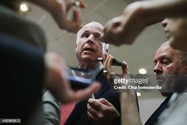 Senate Armed Services Committee Member U.S. Sen. John McCain talks with reporters after being briefed by military officals about the prisoner...