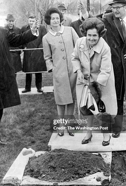 Mary Lasker turns a ceremonial spadeful of earth in East Potomac Park in Washington, DC on April 24, 1966. Behind her, Mrs. Lyndon Johnson and...