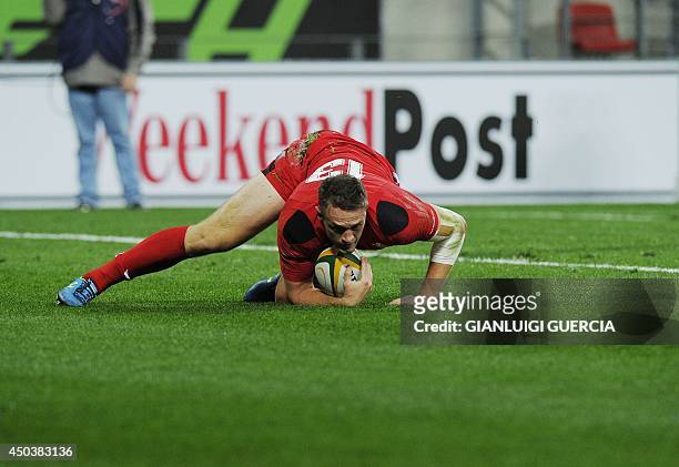 Wales' centre Cory Allen scores a try during the international friendly rugby union match between South Africa's Eastern Province Kings and Wales at...