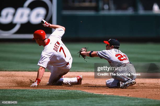 Marcus Giles of the Atlanta Braves attempts to tag out J.D. Drew of the St. Louis Cardinals at Busch Stadium on May 4, 2002 in St. Louis Missouri.