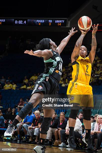 Riquna Williams of the Tulsa Shock shoots against Sugar Rodgers of the New York Liberty during the WNBA game on June 10, 2014 at the BOK Center in...