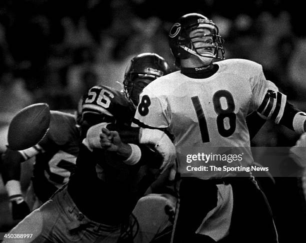 Quarterback Mike Tomczak of the Chicago Bears fumbles against Chris Doleman of the Minnesota Vikings during an NFL game circa 1987 at in Minneapolis,...