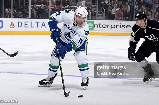 Ryan Stanton of the Vancouver Canucks skates with the puck against the Los Angeles Kings at Staples Center on November 9, 2013 in Los Angeles,...