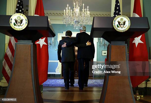 Secretary of State John Kerry and Turkish Foreign Minister Ahmet Davutoglu leave after a joint press availability November 18, 2013 at the State...