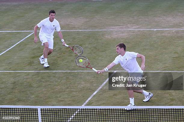 Ken Skupski of Great Britain and Neal Skupski of Great Britain in action during their Men's Doubles match against Grigor Dimitrov of Bulgaria and...