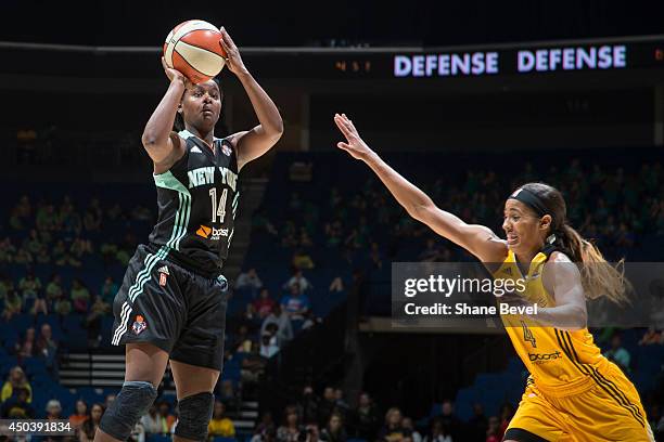 Sugar Rodgers of the New York Liberty shoots against Skylar Diggins of the Tulsa Shock during the WNBA game on June 10, 2014 at the BOK Center in...