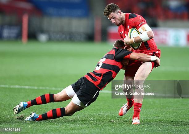 Ronnie Cooke of EP Kings tackles Alex Cuthbert of Wales during the Incoming Tour match between EP Kings and Wales at Nelson Mandela Bay Stadium on...