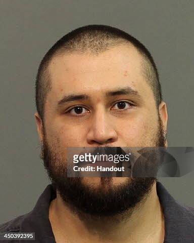 In this handout photo provided by Seminole County Sheriff`s Office, George Zimmerman poses for a mug shot photo after being arrested and booked into...