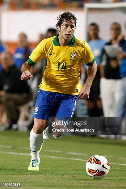 Maxwell of Brazil brings the ball upfield against Honduras on November 16, 2013 during a friendly match at SunLife Stadium Stadium in Miami Gardens,...