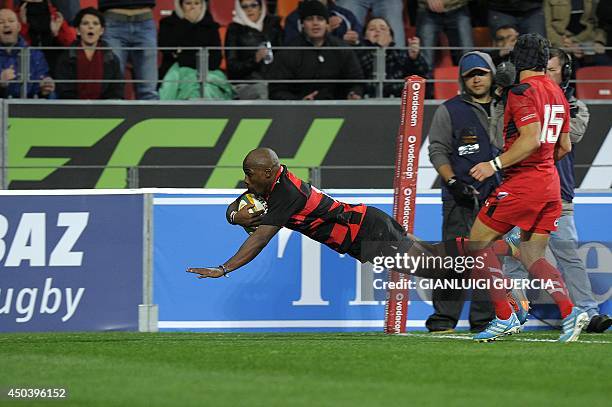 Eastern Province Kings's winger Siviwe Soyizwapi scores a try during the international friendly rugby union match between South Africa's Eastern...