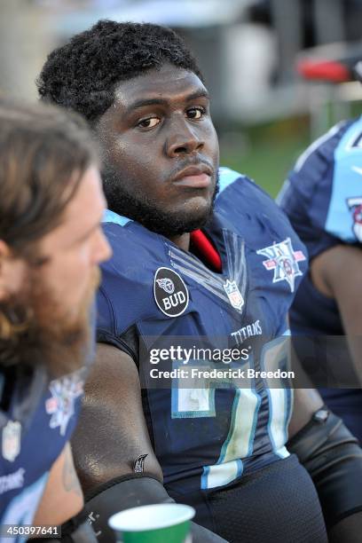Chance Warmack of the Tennessee Titans watches from the sideline during a game against the Jacksonville Jaguars at LP Field on November 10, 2013 in...