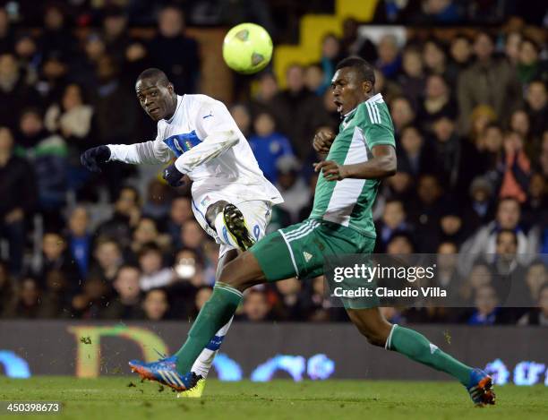 Mario Balotelli of Italy and Azubuike Egwuekwe of Nigeria compete for the ball during the international friendly match between Italy and Nigeria at...
