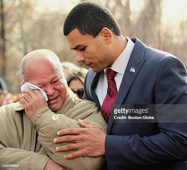Boston's Veterans Services Commissioner Francisco Urena, right, comforted Andy Jimenez, whose son, Army Staff Sergeant Alex Jimenez of Lawrence, was...