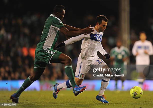 Giuseppe Rossi of Italy is challenged by Azubuike Egwuekwe of Nigeria during an International Friendly match between Italy and Nigeria at Craven...