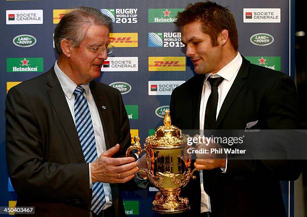 New Zealand All Black captain Richie McCaw hands the William Webb Ellis trophy over to to IRB Chairman Bernard Lapasset at Aviva Stadium on November...