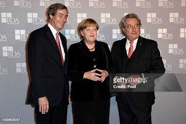 Ingo Kramer, German Chancellor Angela Merkel and Dr. Dieter Hundt pose during a gathering of the German Employers' Federation at The German...