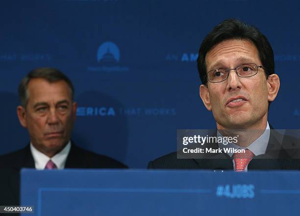House Majority Leader Eric Cantor speaks while flanked by House Speaker John Boehner during a news conference at the U.S. Capitol June 10, 2014 in...