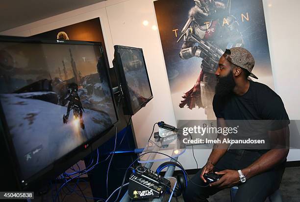 Professional basketball player James Harden gets hands on time with Destiny at the Activision booth during E3 on June 10, 2014 in Los Angeles,...