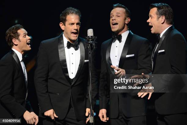 Phil Burton, Andrew Tierney, Michael Tierney and Toby Allen of Human Nature perform on stage during the Apollo Spring Gala and 80th Anniversary...