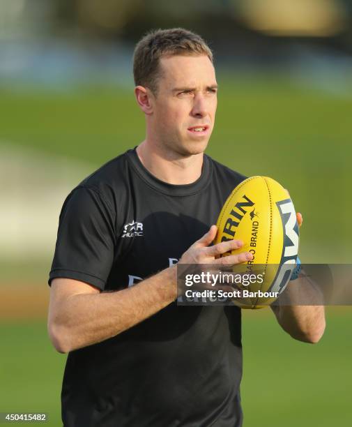 Nick Maxwell of the Magpies runs with the ball during a Collingwood Magpies AFL training session at the Westpac Centre on June 11, 2014 in Melbourne,...