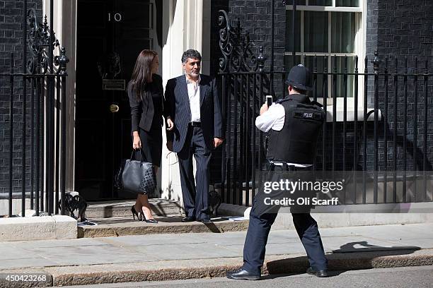 Business entrepreneur James Caan has his photograph taken by a policeman outside Number 10 Downing Street on June 10, 2014 in London, England.