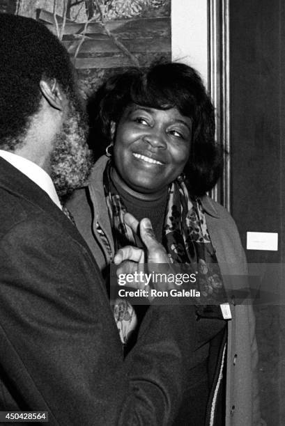 Dick Gregory and Betty Shabazz attend John Denver Photo Exhibit on December 1, 1980 at Hammer Galleries in New York City.