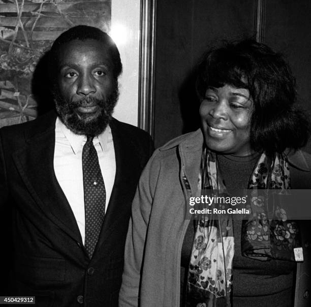 Dick Gregory and Betty Shabazz attend John Denver Photo Exhibit on December 1, 1980 at Hammer Galleries in New York City.