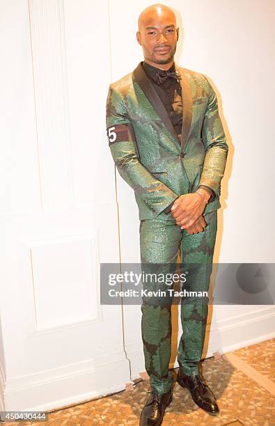 Tyson Beckford prepares to walk the runway during the amfAR Inspiration Gala New York 2014 at The Plaza Hotel on June 10, 2014 in New York City.