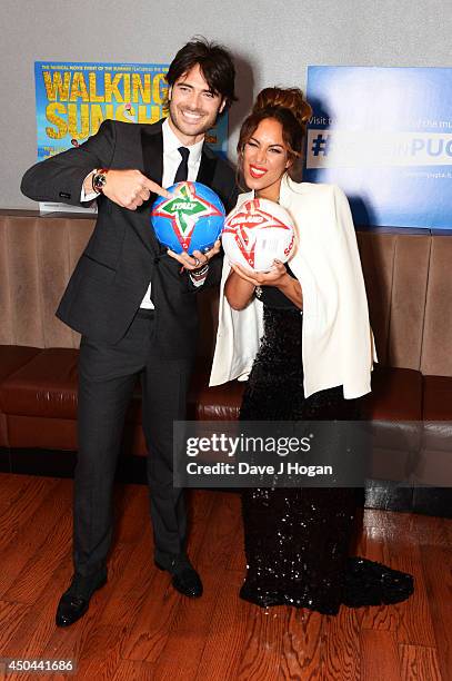 Giulio Corso and Leona Lewis attend the UK premiere of "Walking On Sunshine" at The Vue West End on June 11, 2014 in London, England.