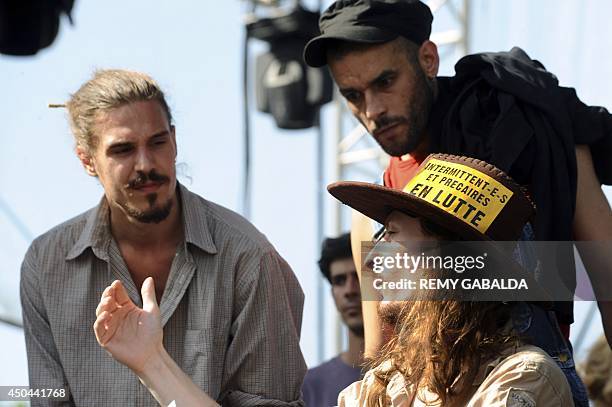 Entertainment industry workers and artists talk on a stage as they take part in a strike and protest after the cancelation of the Rio Loco festival,...