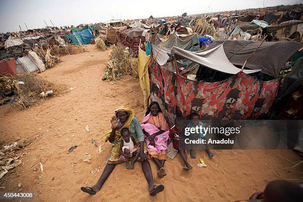 Sudanese people rest near their shelter at Zam Zam refugee camp for Internally Displaced People in North Darfur, Sudan on June 11, 2014. Thousands of...