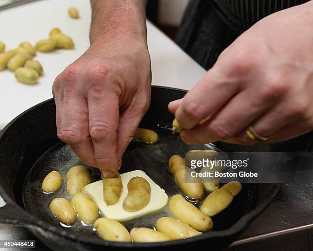 Fingerling potatoes are sauteed in butter and oil and finished in the oven on April 8, 2014.
