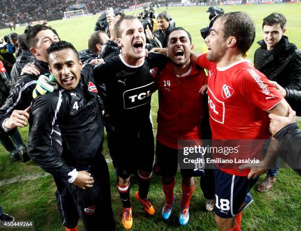Daniel Montenegro, Federico Ins?a and Diego Rodriguez of Independiente celebrate being promoted to first division after one year of playing in...