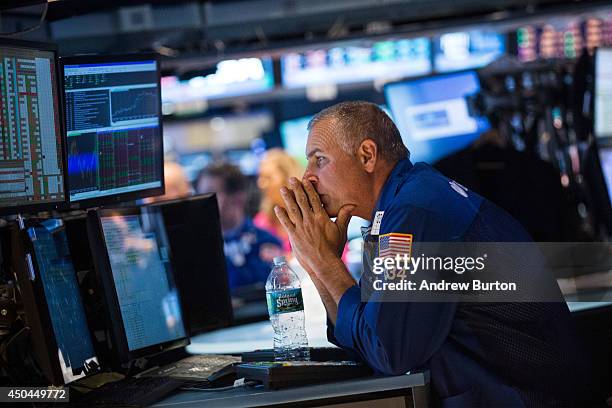 Trader works on the floor of the New York Stock Exchange during the afternoon of June 11, 2014 in New York City. After four days of gains, the Dow...