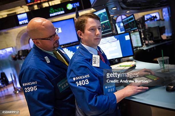 Traders work on the floor of the New York Stock Exchange during the afternoon of June 11, 2014 in New York City. After four days of gains, the Dow...