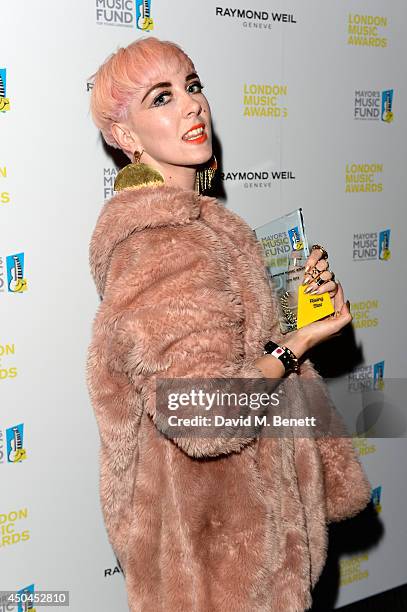 Singer Laura Bettinson aka Femme poses with her Rising Star Award in the winners room as she attends the inaugural London Music Awards which took...