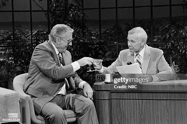 Pictured: Announcer Ed McMahon and host Johnny Carson on March 4, 1983 --