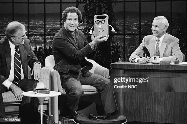 Pictured: Announcer Ed McMahon and actor Albert Brooks during an interview with host Johnny Carson on May 17, 1983--