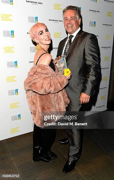 Craig Leach poses with Singer Laura Bettinson aka Femme, winner of the Rising Star Award in the winners room as they attend the inaugural London...