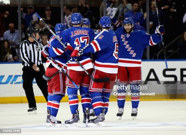 Benoit Pouliot of the New York Rangers celebrates his goal Jonathan Quick of the Los Angeles Kings with his linemates during the first period of Game...