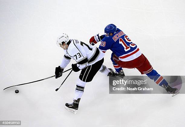 Brad Richards of the New York Rangers reaches to try and stop Tyler Toffoli of the Los Angeles Kings in the first period of Game Four of the 2014...