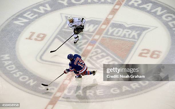 Jeff Carter of the Los Angeles Kings chases Brad Richards of the New York Rangers in the first period of Game Four of the 2014 Stanley Cup Final at...