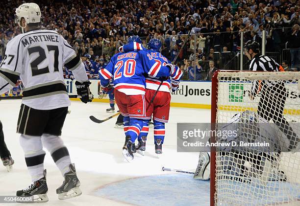Martin St. Louis of the New York Rangers celebrates his goal against Jonathan Quick of the Los Angeles Kings with teammates during the second period...