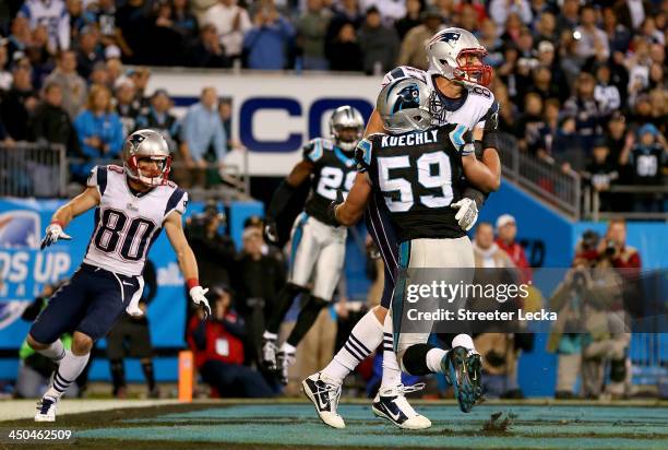 Rob Gronkowski of the New England Patriots and Luke Kuechly of the Carolina Panthers fight for the ball in the end zone on the last play of the game...