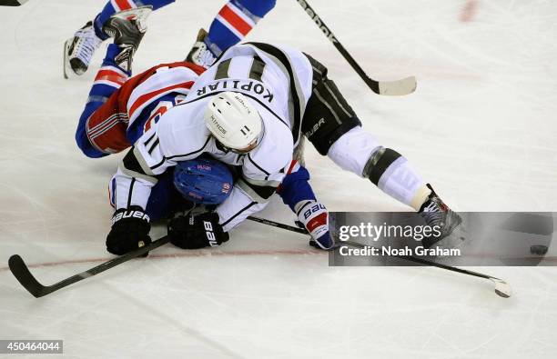 Anze Kopitar of the Los Angeles Kings takes down Marc Staal of the New York Rangers in the third period of Game Four of the 2014 Stanley Cup Final at...