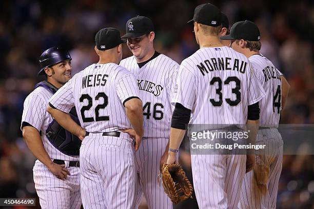 Starting pitcher Tyler Matzek of the Colorado Rockies smiles as he is removed from the game by manager Walt Weiss of the Colorado Rockies in the...