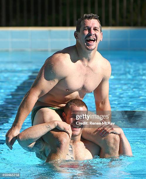 Greg Bird and Trent Merrin joke around in the pool during a New South Wales Blues State of Origin training session at Novotel Coffs Harbour on June...